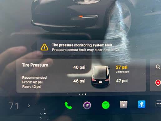 Tesla dashboard showing a tire pressure monitoring system warning